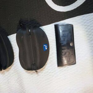 Sunglass cases one Ray Ban side street and two Safe Safe Vision